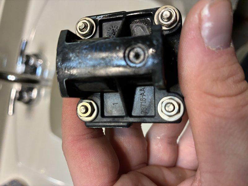 Inspected and diagnosed shower valve system showing significant corrosion and mineral buildup. Documented damaged cartridge mechanism with visible wear on mounting components. Recommended complete valve replacement to address potential water pressure issues and prevent future leaks. Current installation shows evidence of water damage around escutcheon plate.