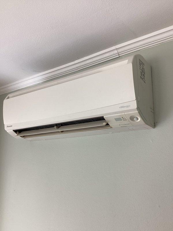 Responded to no heat complaint on Daikin mini-split system. Inspected indoor wall-mounted head unit and outdoor condensing unit which was covered with snow. Connected gauge set to verify refrigerant pressures and performed system diagnostic. Cleared snow accumulation from around outdoor unit to restore proper airflow, allowing system to resume normal heating operation.