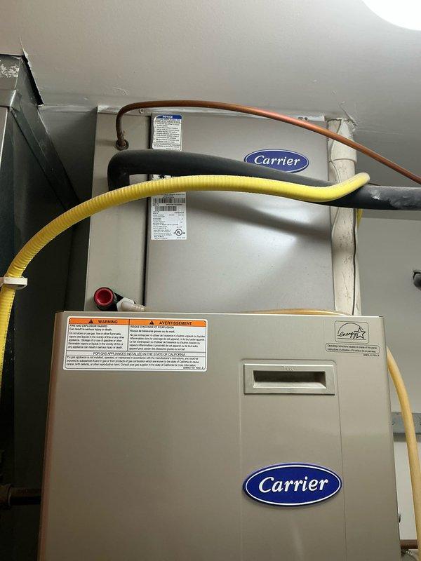 Conducted comprehensive inspection of aging Carrier HVAC system. Interior assessment revealed deteriorated blower motor assembly with significant wear on control board (dated "5/20-07"). Recommended complete system replacement due to advanced equipment age, inefficient operation, and potential for imminent failure. New high-efficiency unit will provide improved reliability and energy performance.