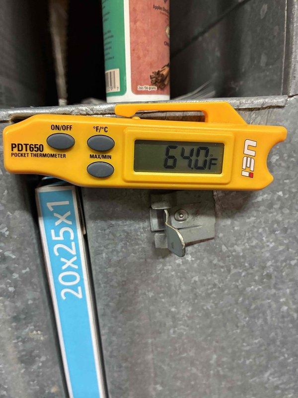 Performed routine HVAC tune-up service including inspection of system components. Replaced dirty air filter with new 20x25x1 filter and verified proper airflow. Temperature readings with digital thermometer showed 64.0°F at supply vent, confirming system is operating within normal temperature parameters.