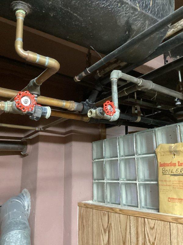 Diagnosed no heat issue on Burnham boiler system less than 10 years old. Inspected manual shutoff valves, pressure regulator, and copper piping configuration. Restored heating functionality by adjusting pressure settings and verifying proper operation of all system components.