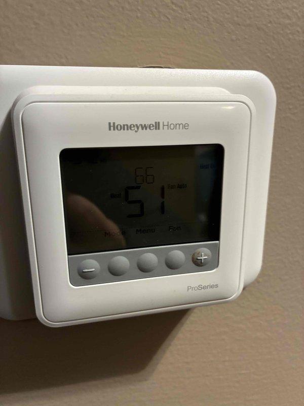 Responded to no-heat call for system less than 10 years old. Identified thermostat issue showing 51°F on Honeywell Home ProSeries display. Inspection of wiring connections at thermostat backplate revealed loose C-wire connection. Secured all wiring connections properly and verified system operation before departure.
