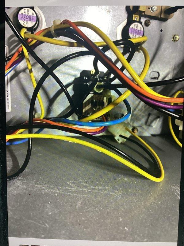 Performed diagnostic inspection of control wiring inside unit. Examined multiple connection points including terminal blocks and control board. All wires were properly routed and secured with no signs of damage or loose connections. System now operating according to specifications.