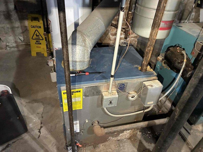 Responded to no-heat call on furnace system less than 10 years old. Diagnosed failed pressure switch in basement mechanical room. Cleaned condensate lines, replaced faulty pressure switch, and verified proper operation of system including the connected hydronic components. System now functioning within normal parameters with heat restored.