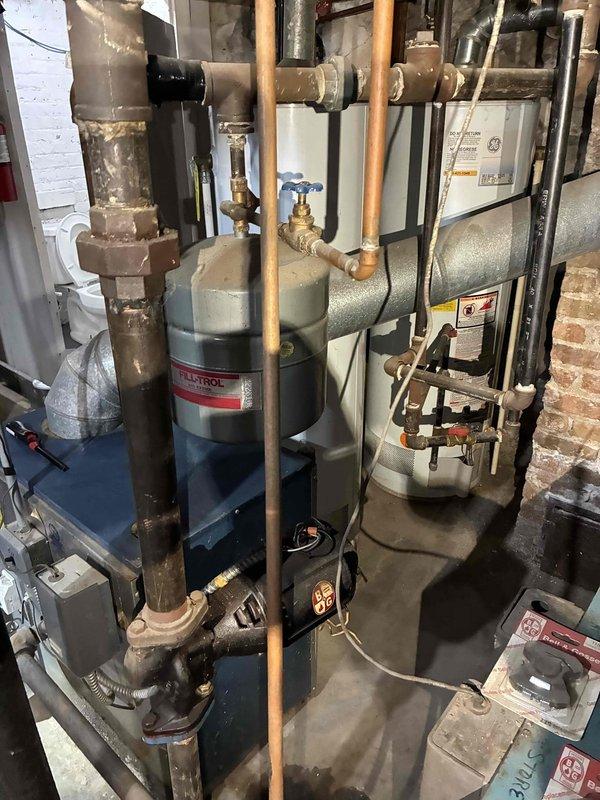 Responded to no-heat call on furnace system less than 10 years old. Diagnosed failed pressure switch in basement mechanical room. Cleaned condensate lines, replaced faulty pressure switch, and verified proper operation of system including the connected hydronic components. System now functioning within normal parameters with heat restored.