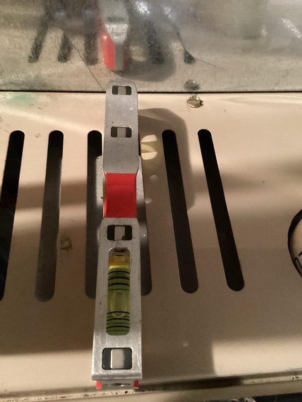 Completed HVAC system tune-up including inspection of furnace interior components. Checked blower motor assembly, electrical connections, and drainage system. Verified system leveling to ensure proper operation and efficiency of the unit.