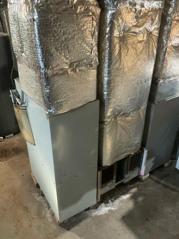 Conducted assessment of existing Bryant furnace system located in basement utility area. Evaluated current installation including primary heating unit, associated ductwork with galvanized metal elbow pipe, and reflective insulation materials. Documented condition of system components to develop appropriate replacement specifications.