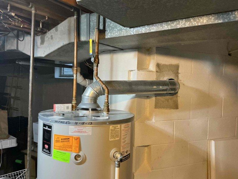 Conducted visual inspection of residential plumbing system, including copper pipe network throughout the basement/crawlspace and water heater installation dating from 12/18/13. Documented existing condition of plumbing infrastructure and identified potential IAQ concerns related to aging water heater and piping system for future remediation planning.