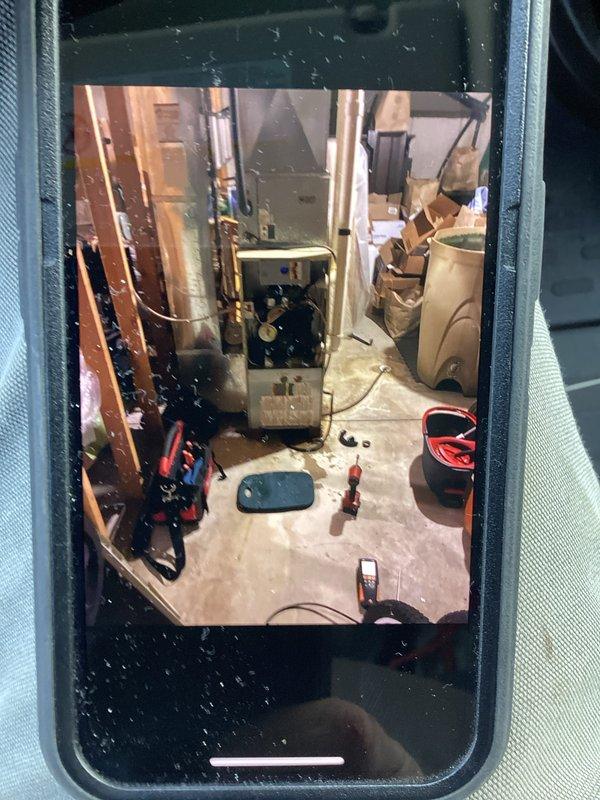 Conducted inspection and maintenance on older model furnace in unfinished utility room. Tools and diagnostic equipment were used to assess system condition. Customer's unit will require follow-up service due to age-related wear observed on internal components.