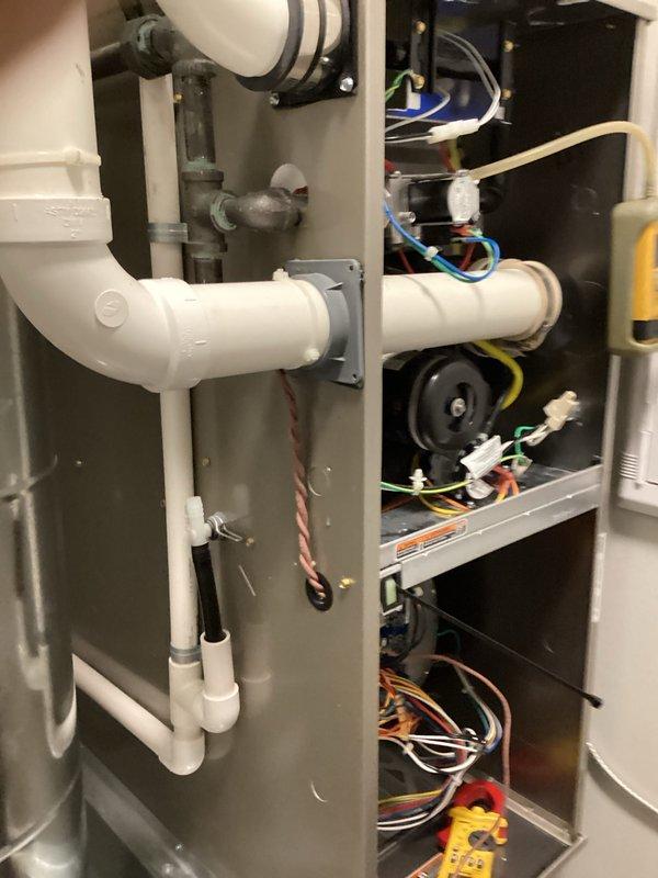 Performed comprehensive HVAC tune-up including combustion analysis using Testo 310 gas analyzer, which revealed optimal temperature readings at 97.2°, 9.4°, and 38.5°. Inspected interior components of the unit, including PVC drainage pipes, electrical connections, and ventilation system. Examined and verified proper operation of the fan motor and valve assembly, ensuring all systems are functioning within manufacturer specifications.