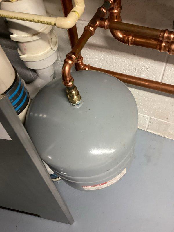 Completed tune-up maintenance on IBC boiler system. Inspected expansion tank, verified proper operation of pressure regulation components, and examined copper supply lines and PVC ventilation/drainage pipes for integrity. Visual inspection showed system in good working order with no immediate concerns.