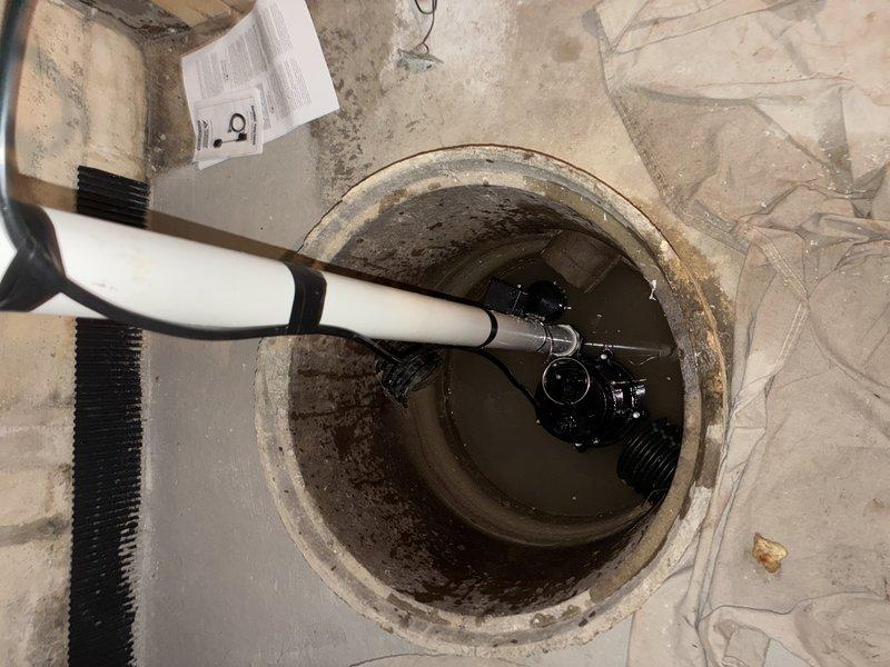 Installed new sump pump system in basement, including proper PVC discharge piping and electrical connections to control unit. Removed debris from sump pit and verified proper operation of the system with successful water evacuation.