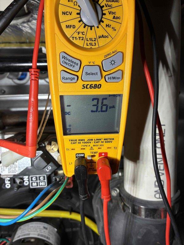 Performed system tune-up service on HVAC equipment. Conducted electrical diagnostics using SC680 multimeter, measuring amperage draw at 3.6 μA DC. Temperature verification with PDT650 thermometer confirmed supply air temperature of 120.2°F, which is within normal operating parameters.