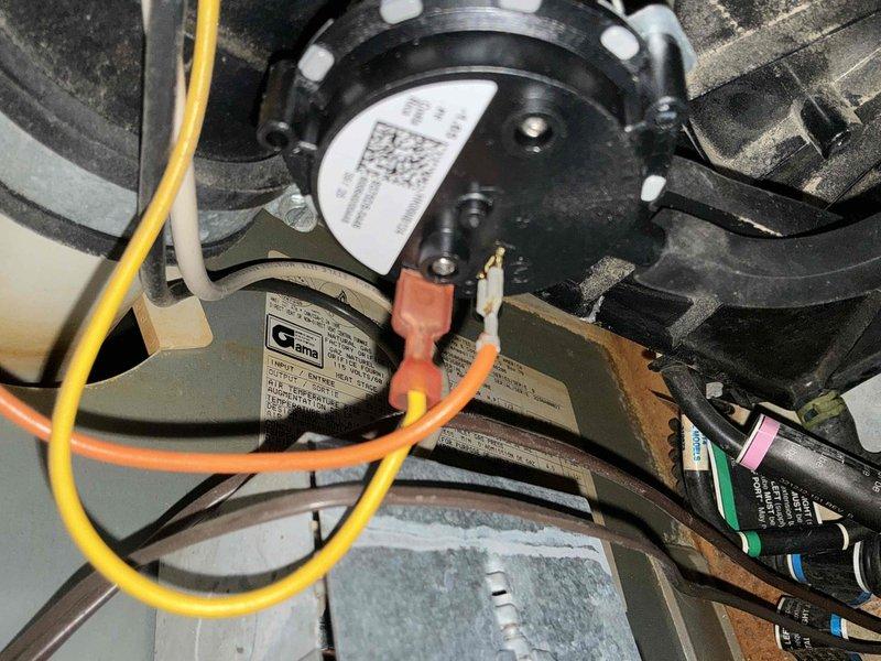 Conducted comprehensive inspection of HVAC system, documenting electrical components including blower motor assembly with multiple wire connections. Evaluated existing electrical service panel to verify adequate power supply and circuit configuration for replacement unit. Photos taken of internal components and electrical panel to document pre-replacement condition and confirm specifications for appropriate system matching.