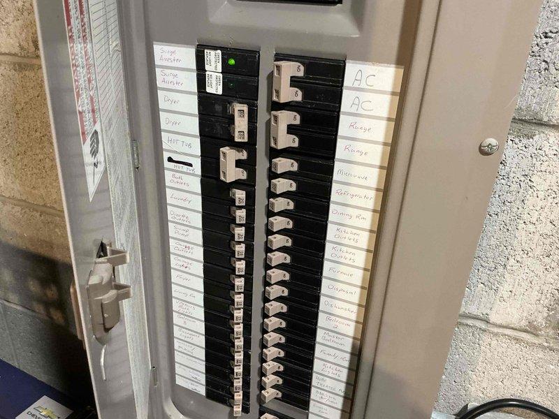 Conducted comprehensive inspection of HVAC system, documenting electrical components including blower motor assembly with multiple wire connections. Evaluated existing electrical service panel to verify adequate power supply and circuit configuration for replacement unit. Photos taken of internal components and electrical panel to document pre-replacement condition and confirm specifications for appropriate system matching.