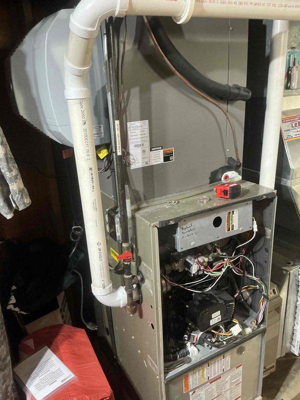 Installed new HVAC system including air handler/furnace unit with integrated control board and blower assembly. Mounted companion humidifier unit to improve indoor air quality. Connected complete system with appropriate PVC ventilation/drainage pipes and ensured proper routing of refrigerant lines and electrical components. All equipment properly secured and tested for optimal operation.