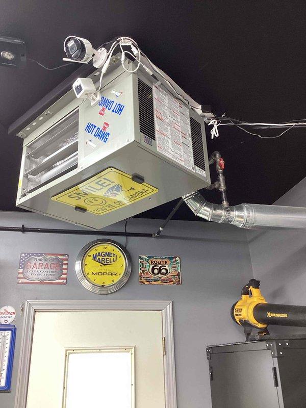 Performed diagnostic service on aging ceiling-mounted HVAC unit installed in garage workshop. Discovered failed ignition control module preventing proper heating function. Replaced control module, cleaned burner assembly, and verified proper ignition sequence and heat output. Unit now operating within normal parameters.