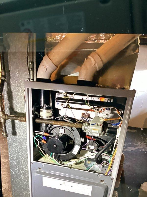 Responded to a no-heat service call on an aging HVAC system (10+ years). Diagnosed failed blower motor as the cause of heating failure. Removed and replaced the blower motor assembly, rewired electrical connections to factory specifications, and verified proper system operation. System now functioning normally with restored heat output.