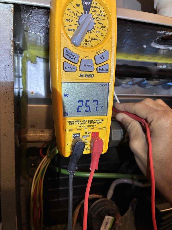 Conducted comprehensive tune-up service on Bryant furnace system. Performed electrical diagnostics with Fieldpiece SC680 multimeter, confirming proper voltage readings at 25.7 VAC. Inspected complete system including ductwork connections, PVC exhaust piping, and secondary air handler component for proper operation and ventilation.