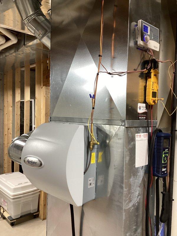 Completed prepaid maintenance service on residential HVAC system including Aprilaire humidifier in basement mechanical room. Performed visual inspection of furnace, air handler, ductwork connections, and refrigerant lines. Checked digital control panel functionality and system operation with diagnostic equipment to ensure all components operating within specifications.