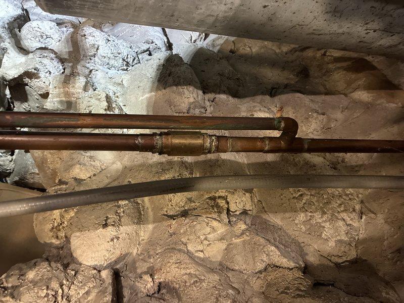 Responded to callback for copper pipe installation with Iron Curtain 2.0 filtration system. Inspected existing plumbing infrastructure in basement area, including copper supply lines, PVC drainage pipes, and Hellenbrand water treatment system. Confirmed proper installation and connections of all components; system functioning as designed.