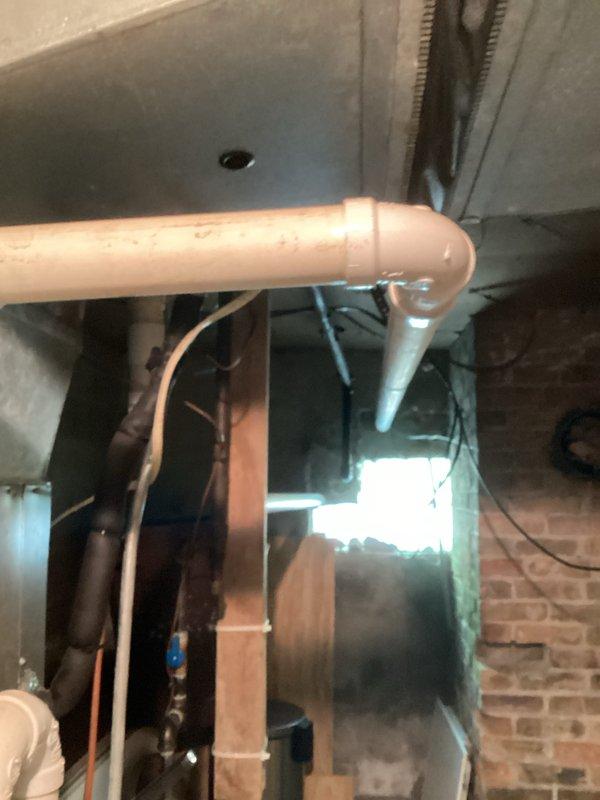 Performed routine commercial HVAC tune-up service on a furnace system. Inspected internal components including blower motor, electrical connections, and control modules. Checked condensate drain line and PVC venting system for proper installation and function. All systems operating within normal parameters after service.