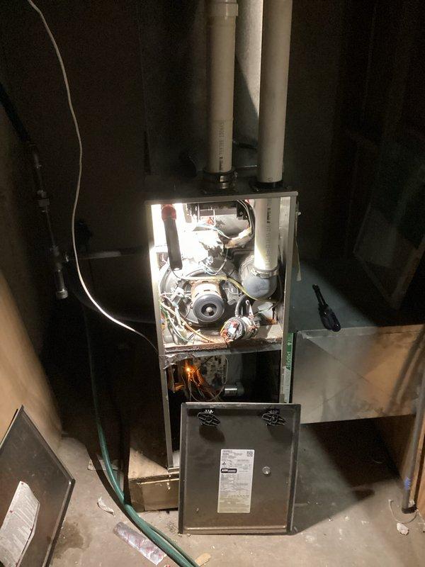 Responded to no-heat call on a relatively new furnace system. Upon inspection, identified issues with the blower motor showing signs of dust accumulation and electrical connection problems. Cleaned internal components, tightened loose wiring connections, and verified proper operation after service with the system now producing adequate heat.