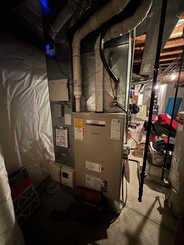 Conducted comprehensive evaluation of existing HVAC system in residential basement. Documented aged furnace with deteriorating ductwork and outdated humidifier system requiring replacement. Recommended complete HVAC system upgrade including high-efficiency furnace unit, properly sized ductwork, and modern humidity control system to improve home comfort and energy efficiency.