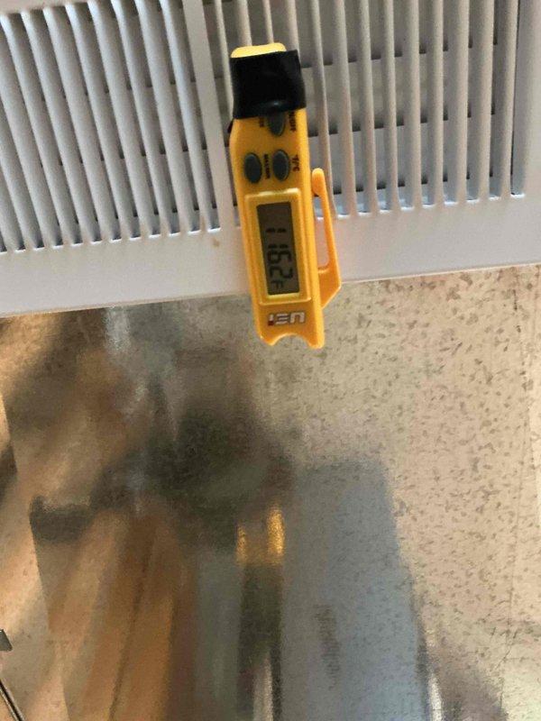 Performed standard tune-up service on HVAC system. Identified minor mold formation at corner junction of ductwork and measured supply air temperature at 25.8°F, which falls within normal operational parameters. Cleaned affected area and verified proper system function.