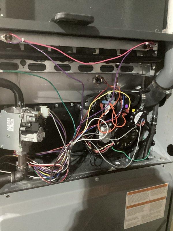 Performed preventative maintenance tune-up on HVAC system. Opened access panel to inspect electrical connections and wiring integrity across all components. Verified level installation of unit with bubble level tool to ensure proper operation and drainage.