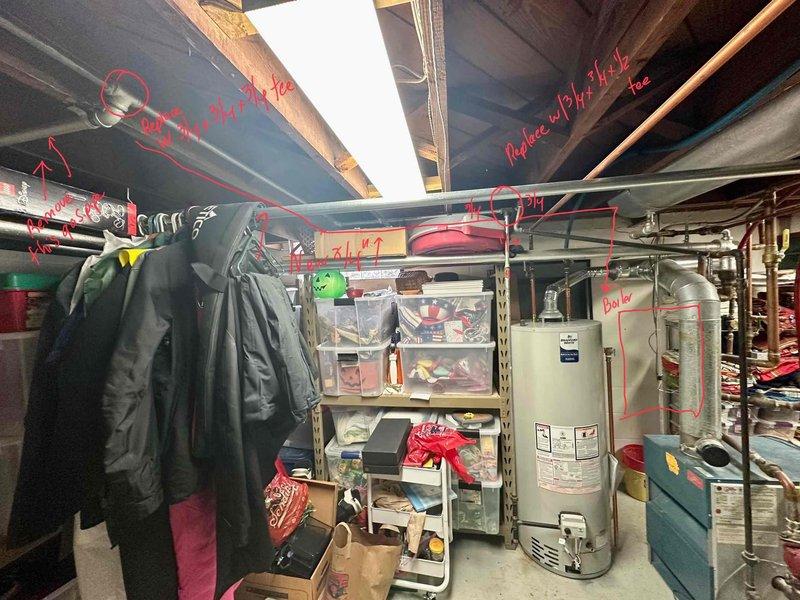 Conducted inspection of basement area housing existing HVAC infrastructure. Documented exposed ceiling joists, PVC piping configuration, and current water heater installation. Identified storage items requiring relocation prior to equipment replacement. Evaluated utility space layout for optimal new system placement considering existing ductwork and plumbing connections.