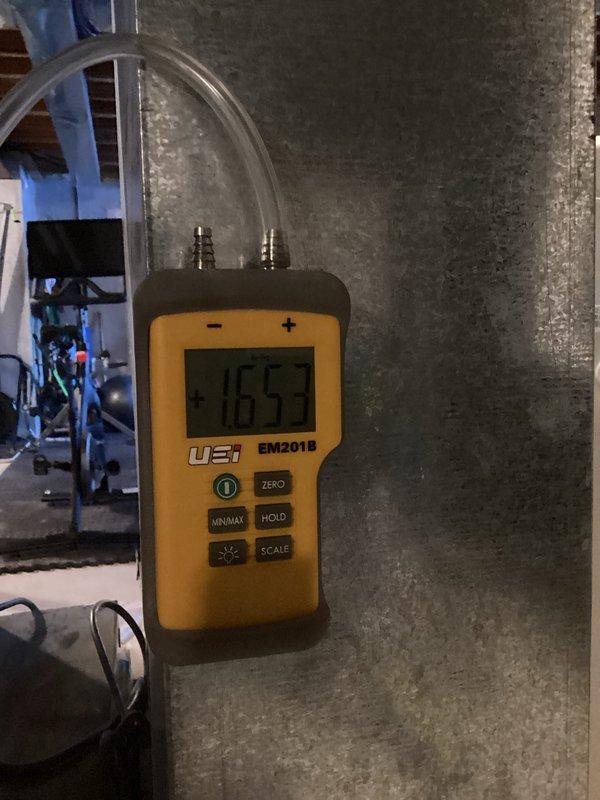 Completed installation of new furnace with system pressurization verified at 1653 on UEi EM201B meter. Ensured proper integration with existing utility room infrastructure including water heater and treatment systems. Final inspection confirmed all connections secure and system operating within specifications.