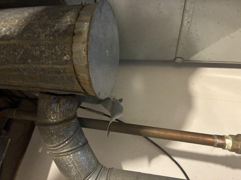 Conducted comprehensive gas pressure test on residential plumbing system. Inspected metal ductwork connections and copper gas lines for potential leaks. Located and sealed minor leak at copper pipe fitting near ductwork junction, and verified proper operation of PVC venting system. Final pressure test confirmed system integrity with no remaining leaks present.