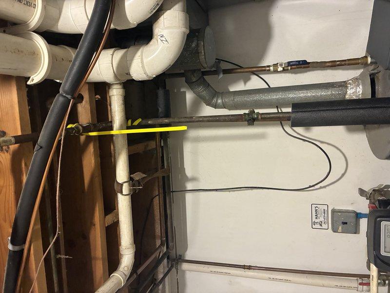 Conducted comprehensive gas pressure test on residential plumbing system. Inspected metal ductwork connections and copper gas lines for potential leaks. Located and sealed minor leak at copper pipe fitting near ductwork junction, and verified proper operation of PVC venting system. Final pressure test confirmed system integrity with no remaining leaks present.