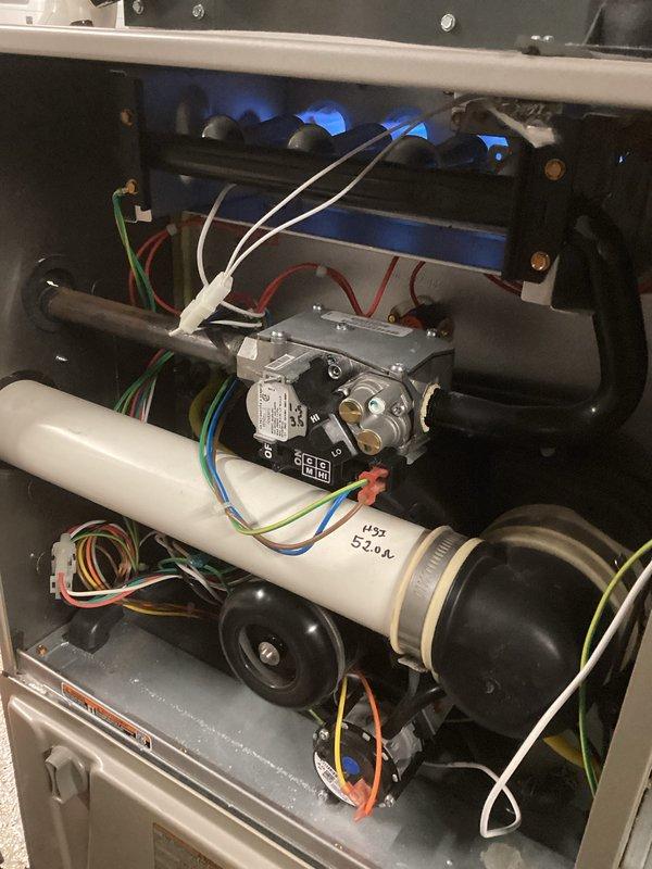 Performed routine maintenance on gas furnace system. Inspected combustion assembly and verified proper blue flame pattern indicating optimal combustion efficiency. Checked gas valve assembly, control wiring connections, and heat exchanger for proper operation.