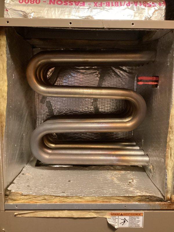 Performed routine seasonal tune-up on HVAC system. Inspected copper heating coil for integrity, confirming proper condition despite some aging. Disassembled light blue panel with heating elements for cleaning and testing with diagnostic equipment, and reassembled all components to ensure optimal system operation.