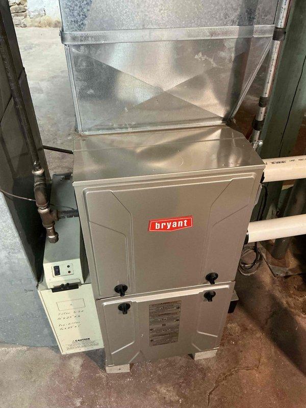 Completed routine tune-up on Bryant furnace system located in basement. Inspected unit and found evidence of rust developing on heat exchanger surface. Performed standard maintenance including filter change, combustion analysis, and system operation verification.