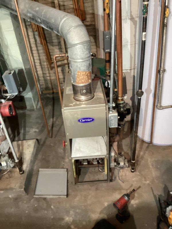 Performed comprehensive tune-up on Carrier furnace system and Roth oil-fired water heater. Cleaned and inspected all critical components including heat exchanger, burners, and ductwork connections. Checked operation of safety controls and verified proper combustion efficiency. Both units are functioning within manufacturer specifications with no immediate concerns identified.
