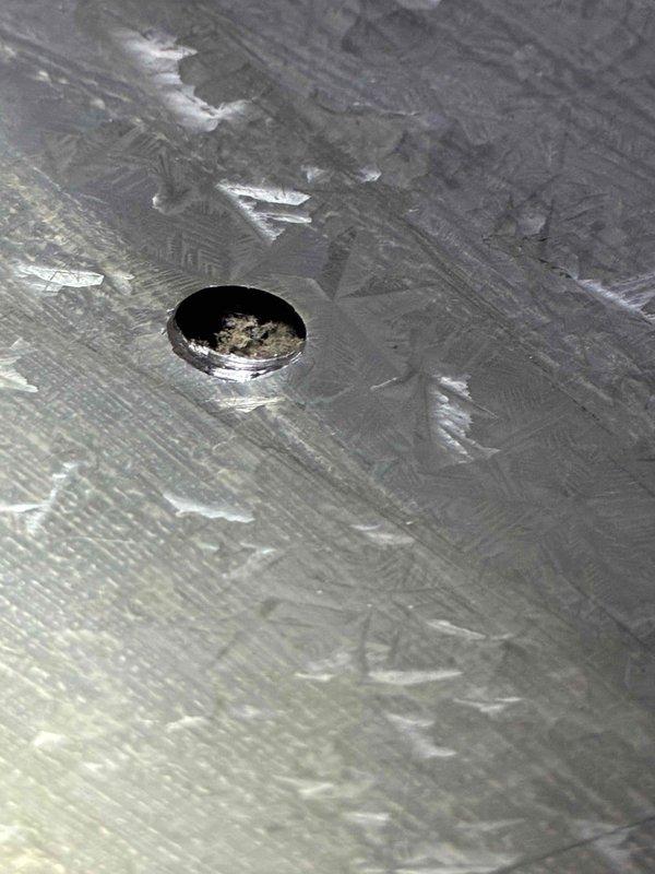 Performed scheduled tune-up of HVAC system including inspection of metal components and interior compartment. Observed minor condensation on interior surfaces and verified integrity of the heat exchanger opening. System was returned to proper operating condition with all connections secured.