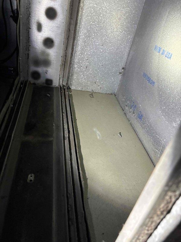 Performed scheduled tune-up of HVAC system including inspection of metal components and interior compartment. Observed minor condensation on interior surfaces and verified integrity of the heat exchanger opening. System was returned to proper operating condition with all connections secured.