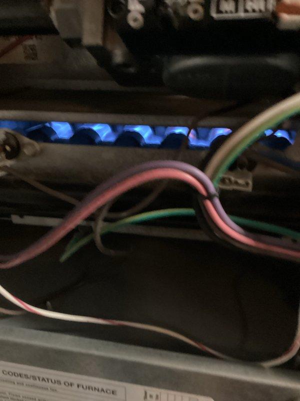 Performed routine tune-up service on a gas furnace system. Inspected burner assembly, confirming proper flame characteristics and operation. Examined electrical connections and wiring integrity. Visually inspected ductwork system for proper installation and sealing, noting appropriate use of metal foil tape at connection points.