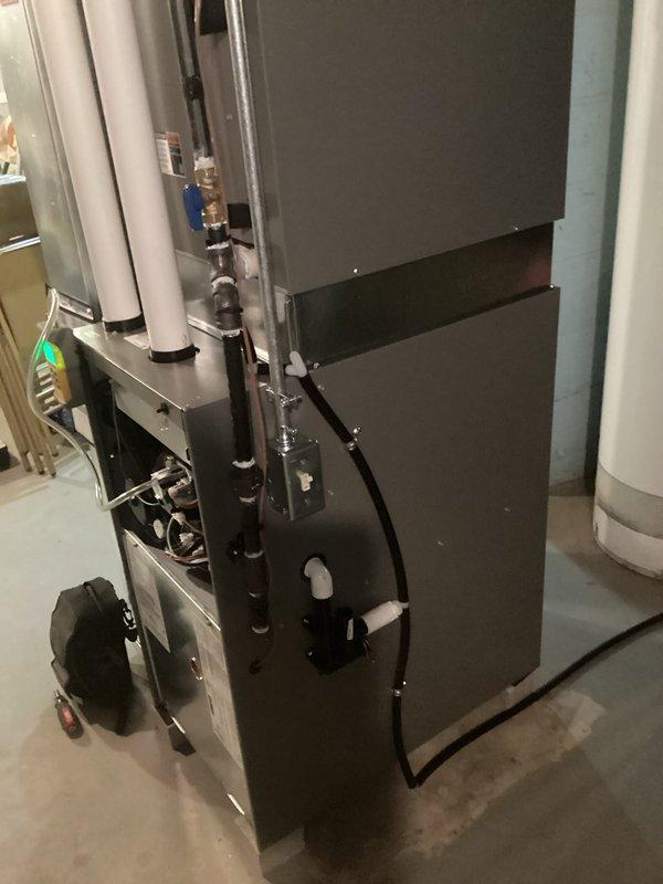 Successfully installed and commissioned a new Lennox furnace system in basement utility area. Completed professional installation of dual PVC vent pipes, drain lines, and all necessary electrical connections. System was tested and verified operational as evidenced by indicator light and proper function.