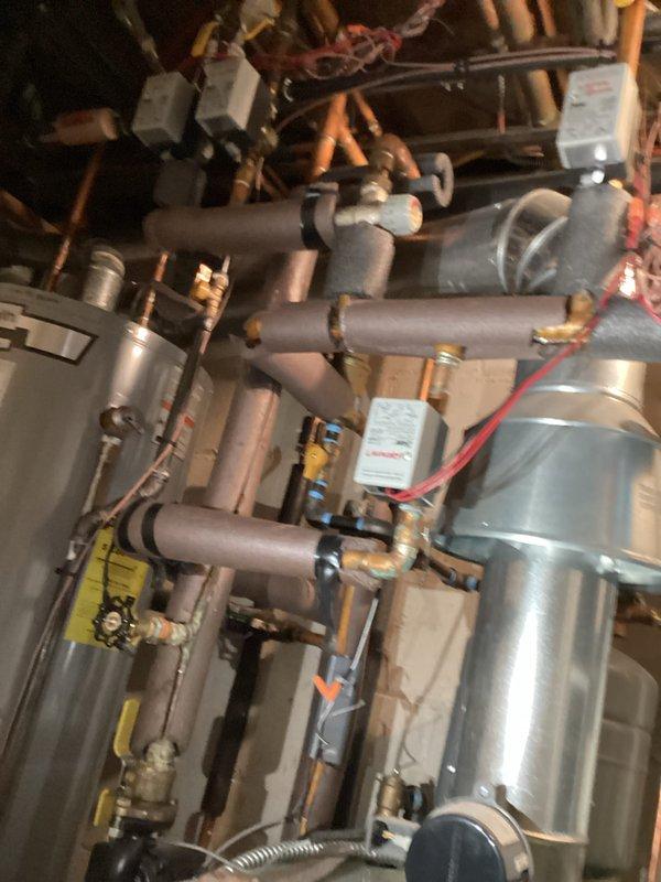 Performed comprehensive furnace tune-up including inspection of heat exchanger, control board operation, and electrical connections. System showed proper flame pattern with normal combustion sequence. Examined adjacent mechanical room piping system and insulation for proper installation and potential issues. All components functioning within specifications with no immediate concerns identified.