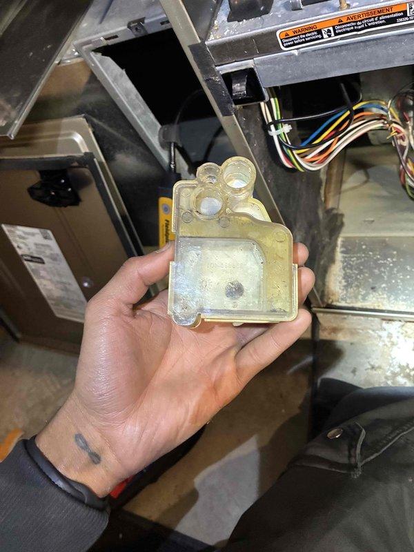 Performed tune-up service on HVAC system with inspection of heat exchanger components and refrigeration lines. Noted minor corrosion on heat exchanger tubes and identified a frozen/iced condensate trap. Cleaned corroded areas, thawed and cleared blocked condensate drain assembly, and verified proper system operation after service. System now functioning within normal parameters.