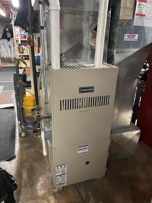 Responded to a no-heat call for an aging Concord furnace. Upon inspection, found faulty ignition sequence preventing proper burner operation. Cleaned flame sensor, replaced worn ignition module on control board, and verified proper operation through multiple heating cycles. System now functioning correctly with normal flame characteristics and appropriate temperature rise.
