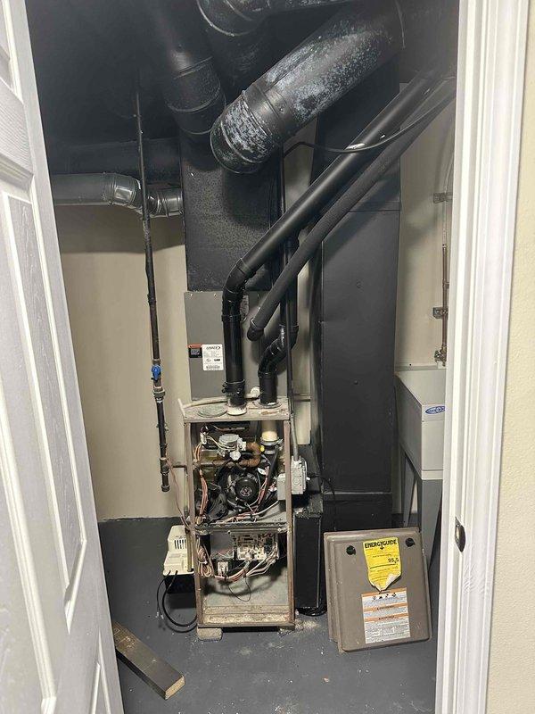 Completed comprehensive inspection of aging HVAC system located in utility closet. Assessed furnace unit with visible wear on internal components (copper tubing and wiring) and evaluated adjacent air handler with efficiency concerns. Recommended full system replacement to improve energy efficiency and reliability, with new equipment properly sized for the residence.