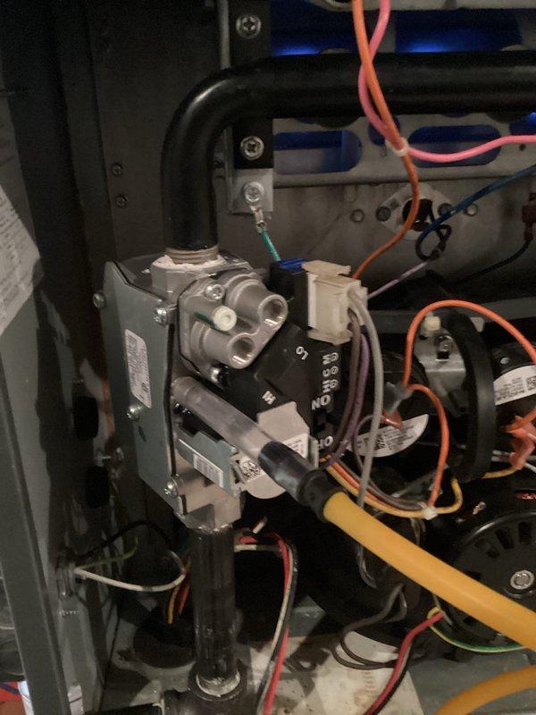Performed warranty diagnostic inspection on furnace heating system. Visual examination of burner assembly confirmed proper flame pattern and combustion. Inspected gas valve assembly and associated connections, verifying all electrical components and wiring were in good working condition with no signs of deterioration.