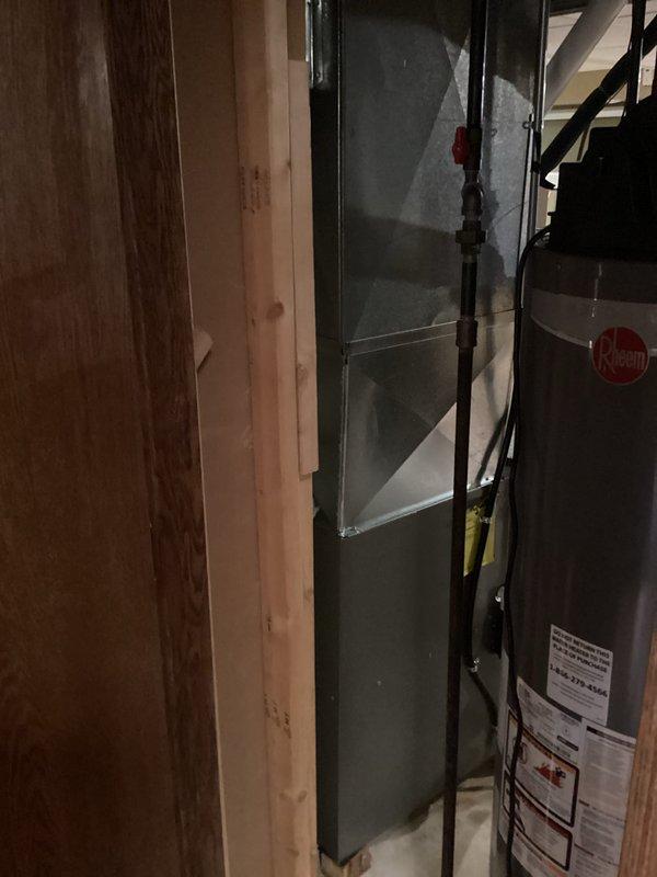 Successfully installed a new HVAC system in the utility area, featuring a furnace unit with proper PVC exhaust venting. Connected all necessary gas lines, electrical components, and conduits according to manufacturer specifications, ensuring proper integration with the existing Rheem water heater system.