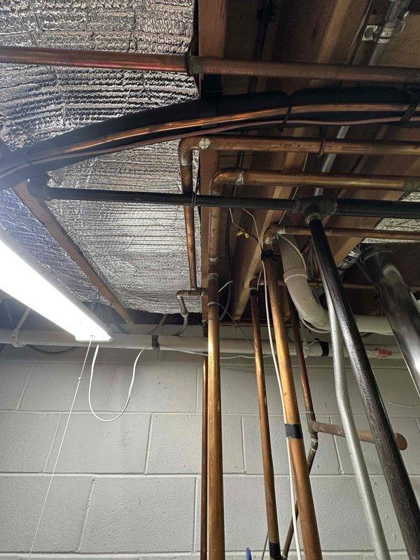 Conducted comprehensive evaluation of existing boiler system in basement utility area. Inspected copper distribution piping network and water treatment components, including WaterBoss filtration system. Documented current installation configuration and identified potential optimization opportunities for heating efficiency.