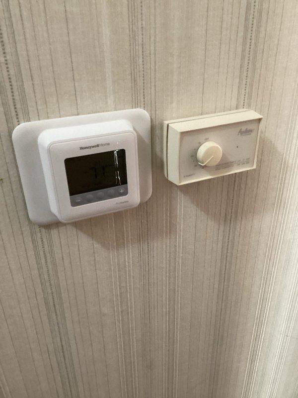 Successfully completed installation of a new Honeywell furnace system with digital thermostat upgrade. Installed and calibrated a Magnehelic gauge to monitor system pressure differentials for optimal performance. The new setup includes both the legacy Aprilaire controller and modern Honeywell Home digital thermostat, ensuring seamless climate control transition.